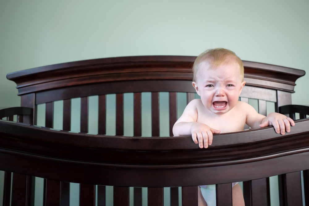 why do babies cry in their sleep?
