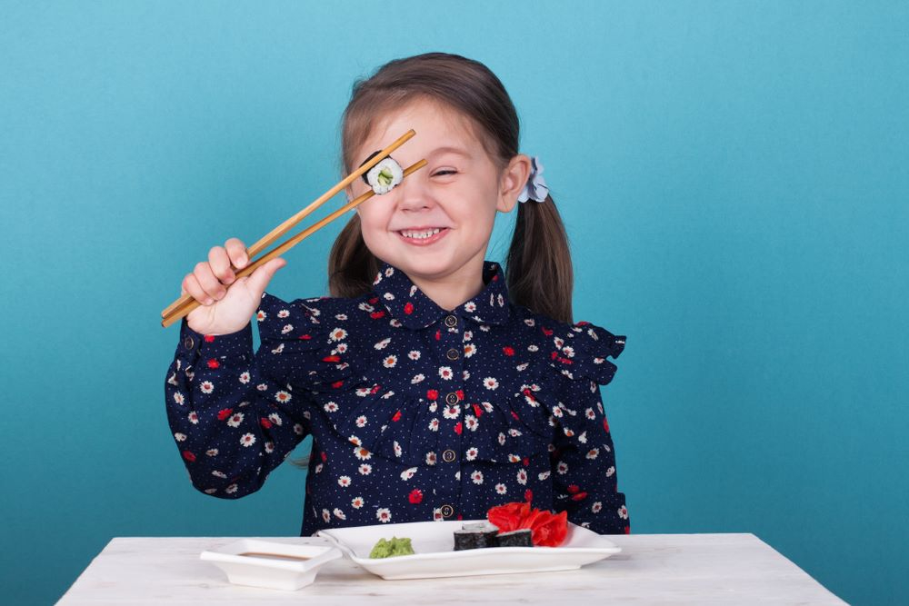 How to use chopsticks for kids, kid holding a chopstick