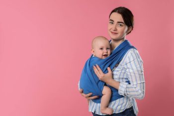 how to hold infant on airplane